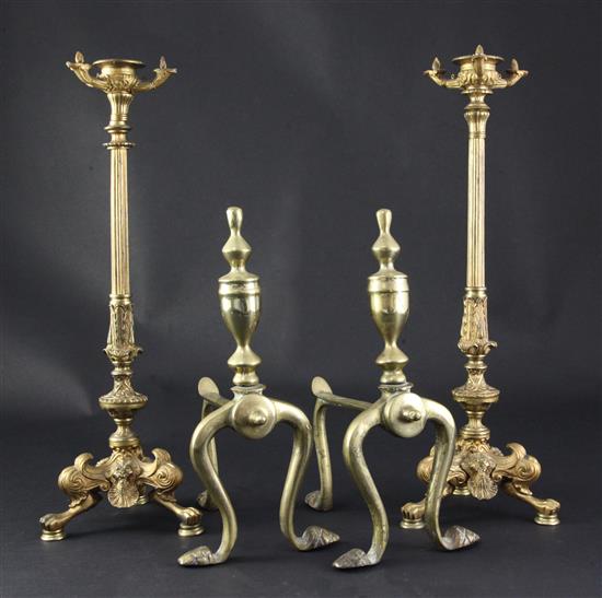 A pair of ormolu candlesticks and a pair of brass andirons